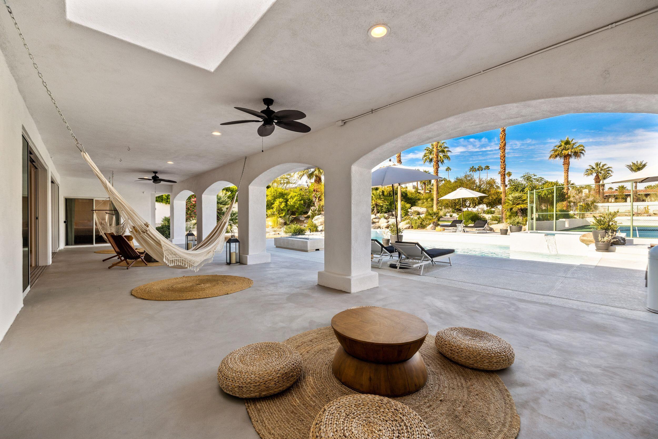 594 West Stevens Road Palm Springs, CA 92262 - Photo 24 of 28 a view of a livingroom with furniture and a floor to ceiling window