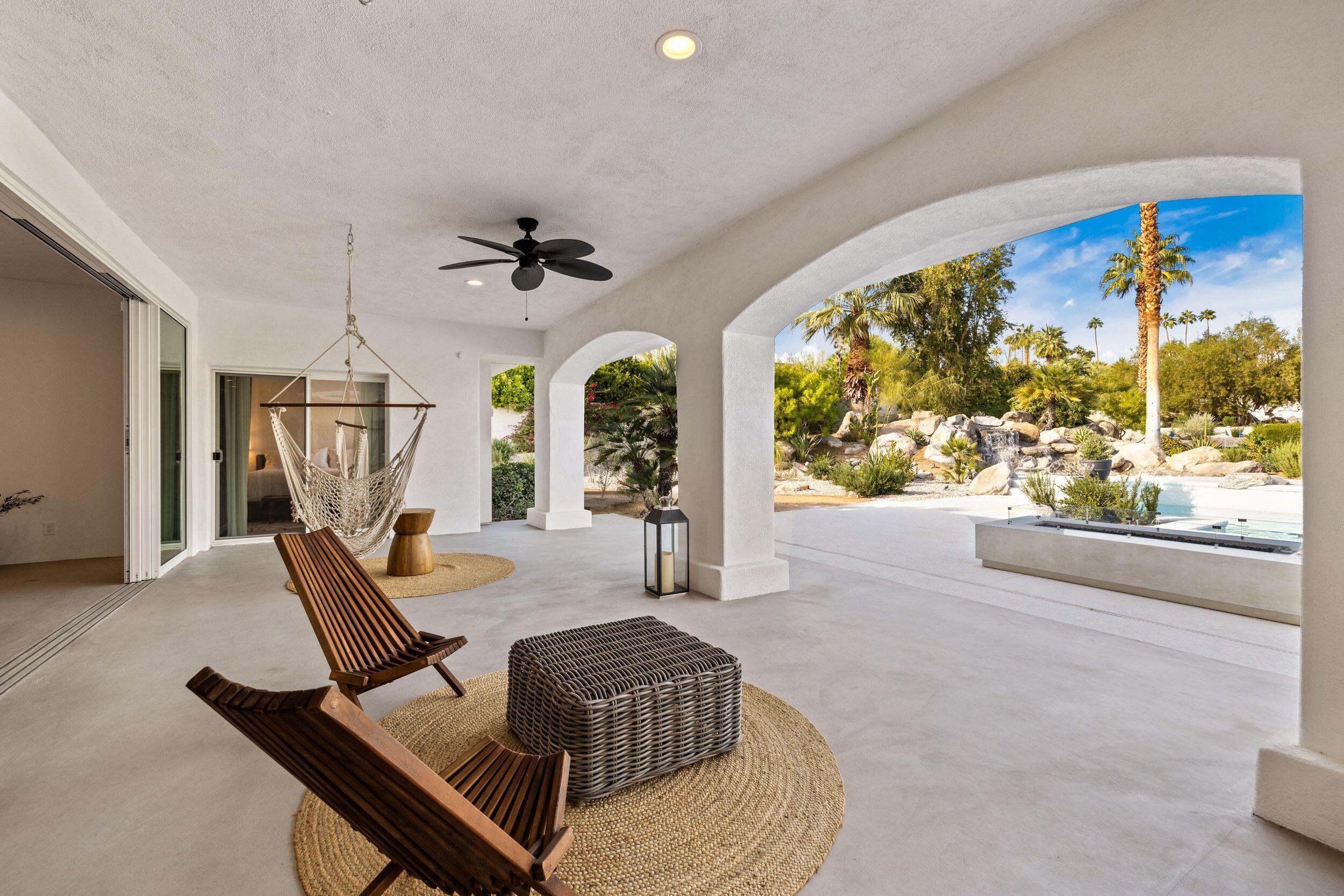 594 West Stevens Road Palm Springs, CA 92262 - Photo 25 of 28 a view of a livingroom with furniture and a floor to ceiling window