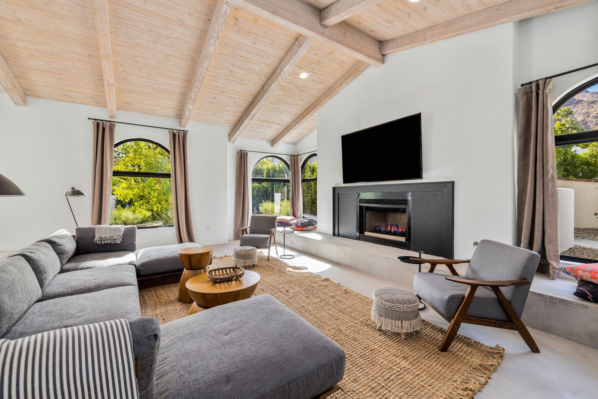594 West Stevens Road Palm Springs, CA 92262 - Photo 10 of 28 a living room with furniture fireplace and window