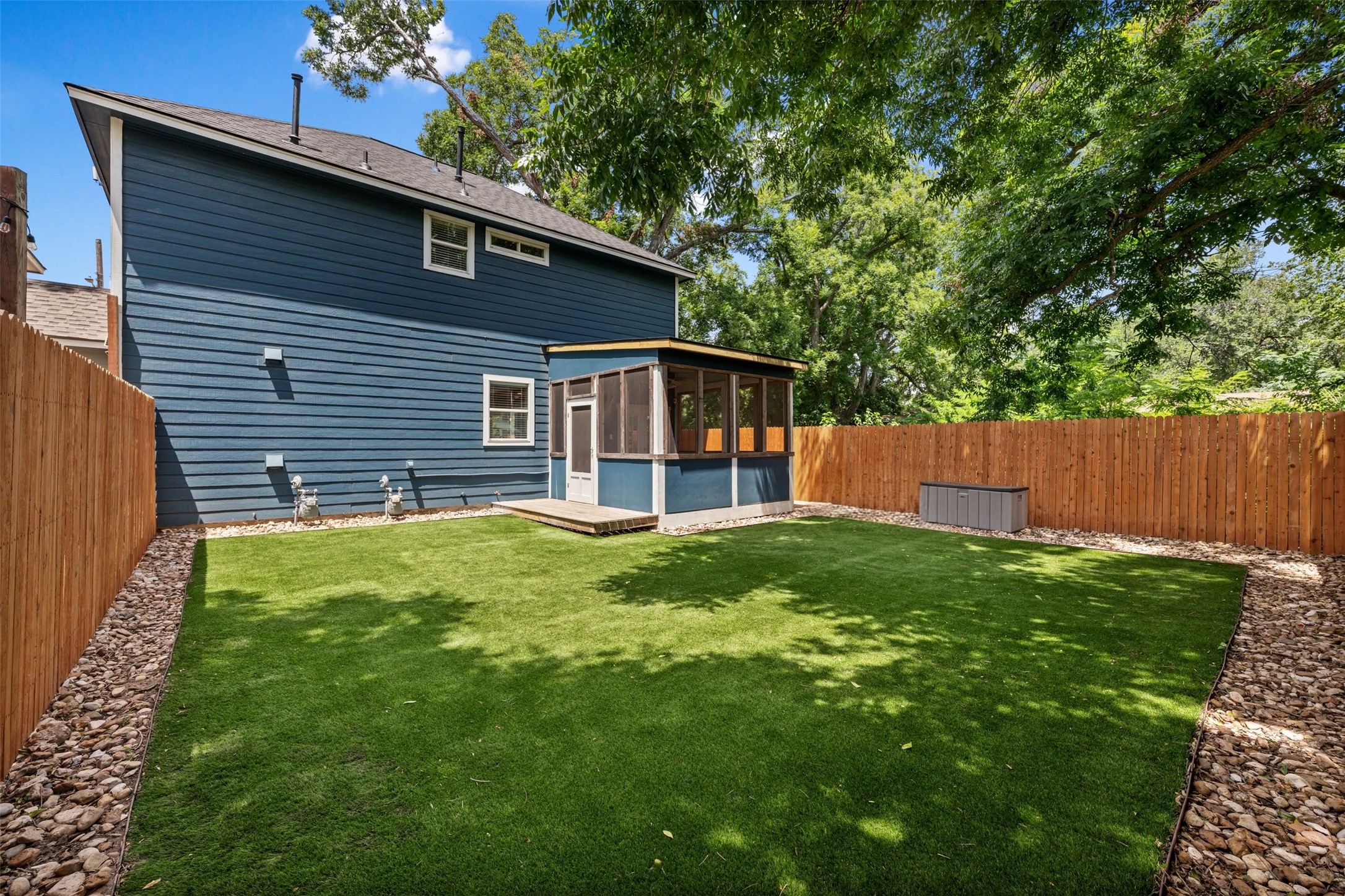 4912 Sara Drive, Unit A Austin, TX 78721 - Photo 28 of 28 View of the shaded backyard and screened in porch.