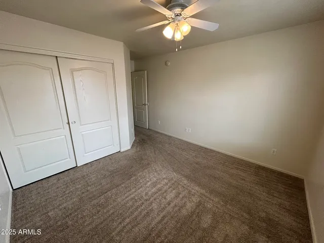 an empty room with fan