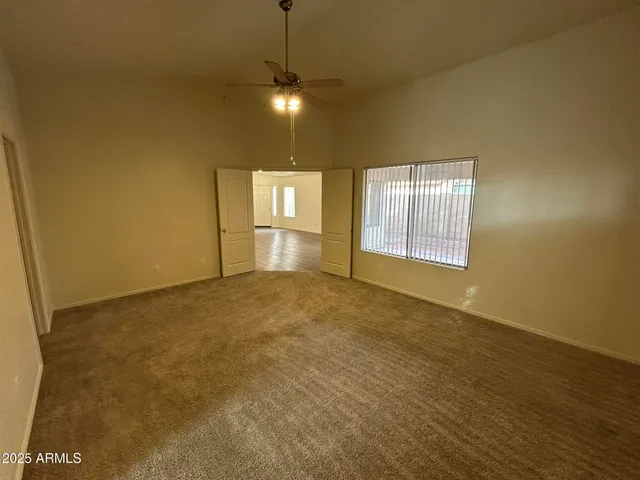 a view of an empty room with a window
