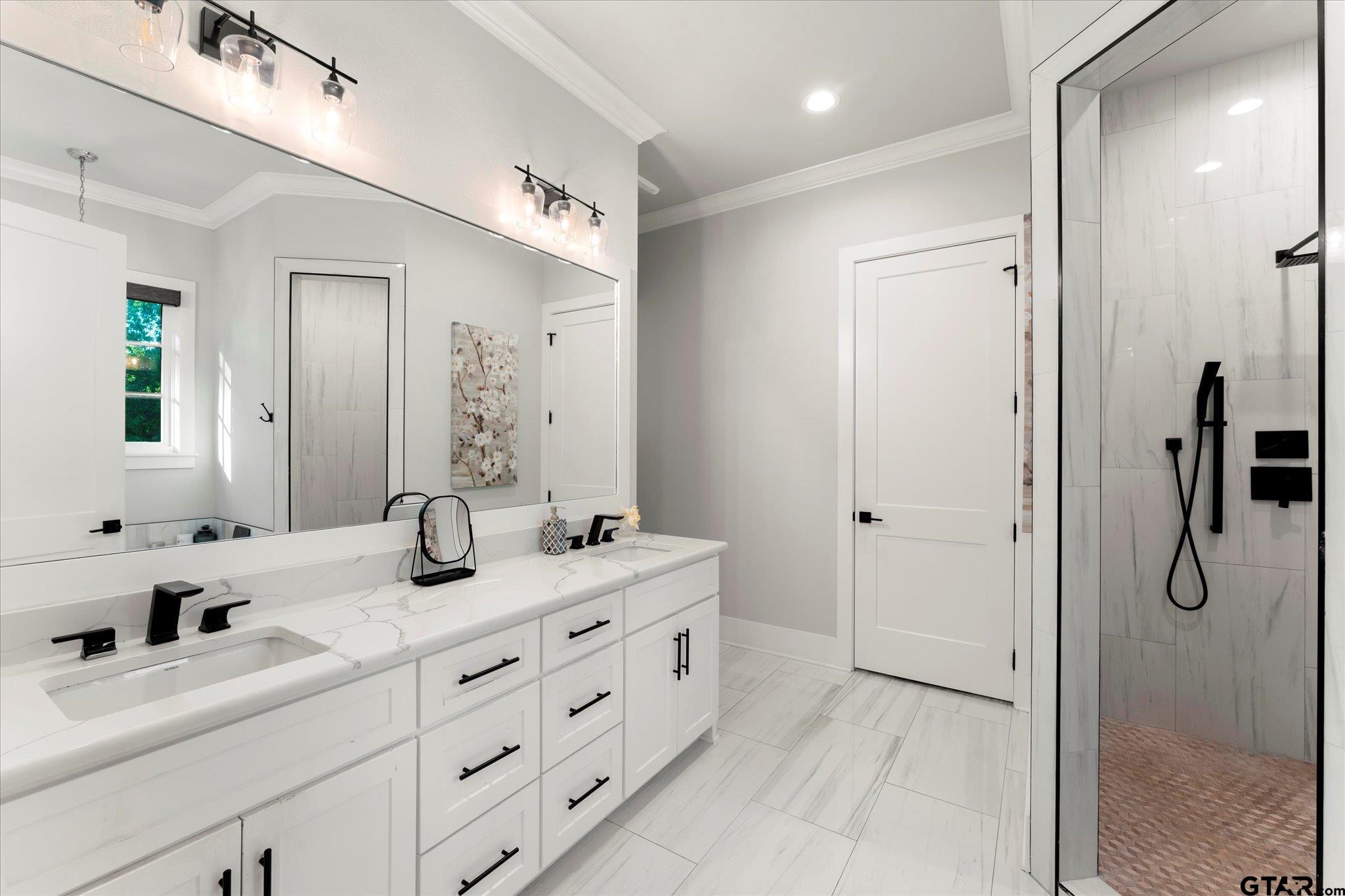 4301 Windrush Boulevard Longview, TX 75604 - Photo 17 of 36 a bathroom with a granite countertop sink mirror and double