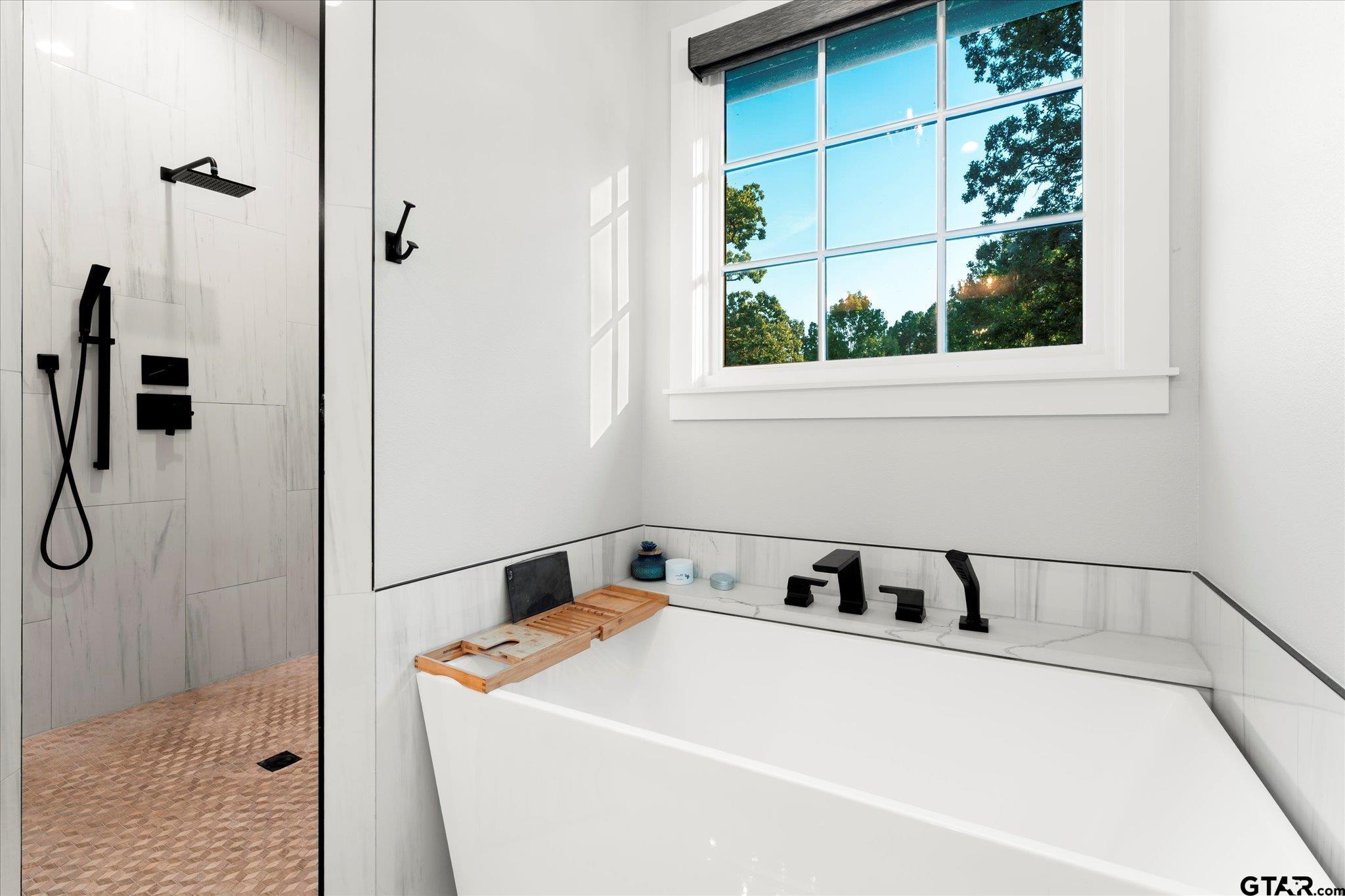 4301 Windrush Boulevard Longview, TX 75604 - Photo 18 of 36 a utility room with a shower and mirror