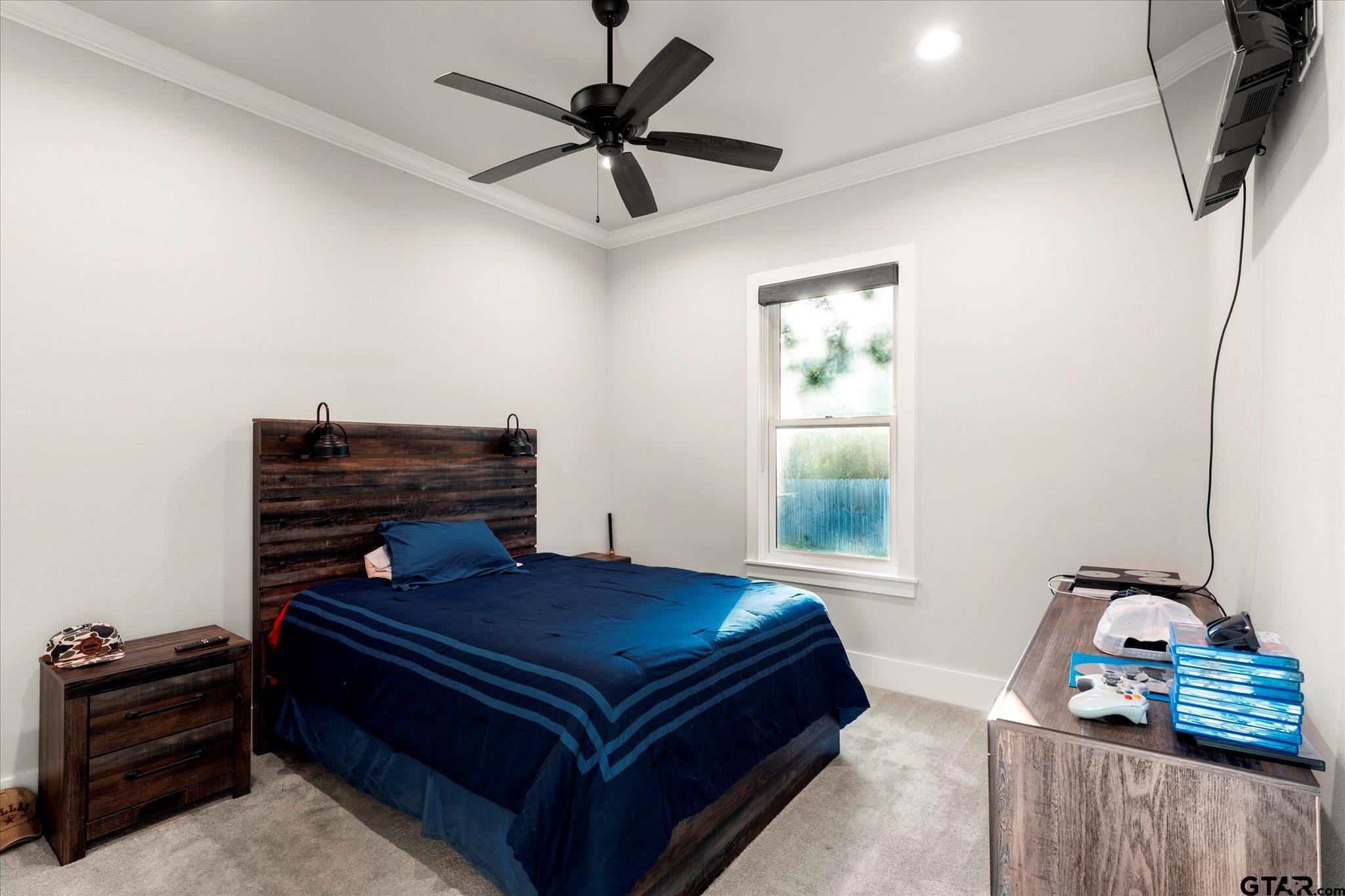 4301 Windrush Boulevard Longview, TX 75604 - Photo 21 of 36 a bedroom with furniture and a window