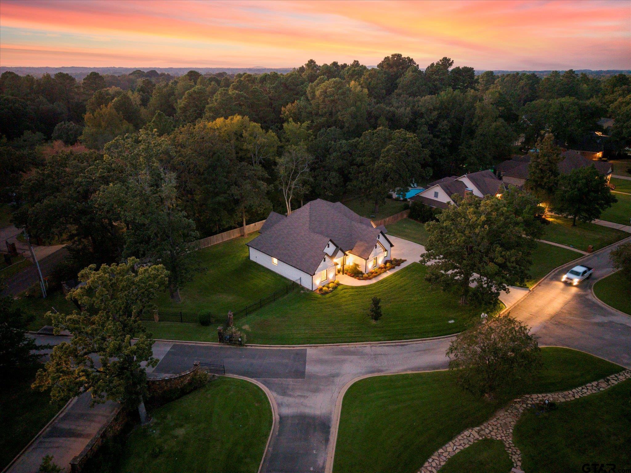 4301 Windrush Boulevard Longview, TX 75604 - Photo 28 of 36 an aerial view of a house with a garden