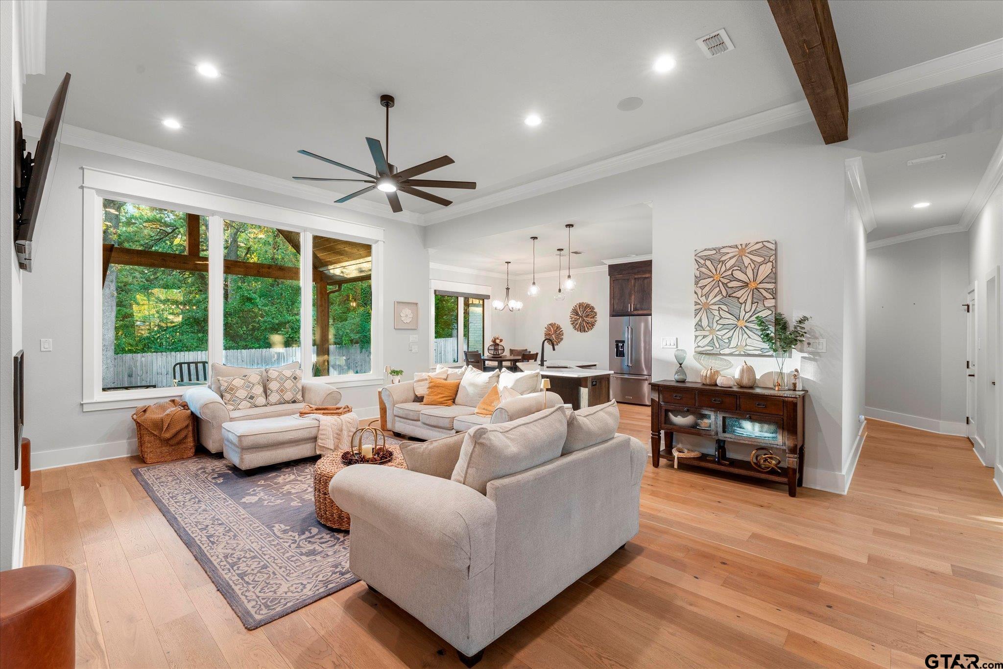 4301 Windrush Boulevard Longview, TX 75604 - Photo 9 of 36 a living room with furniture and large windows