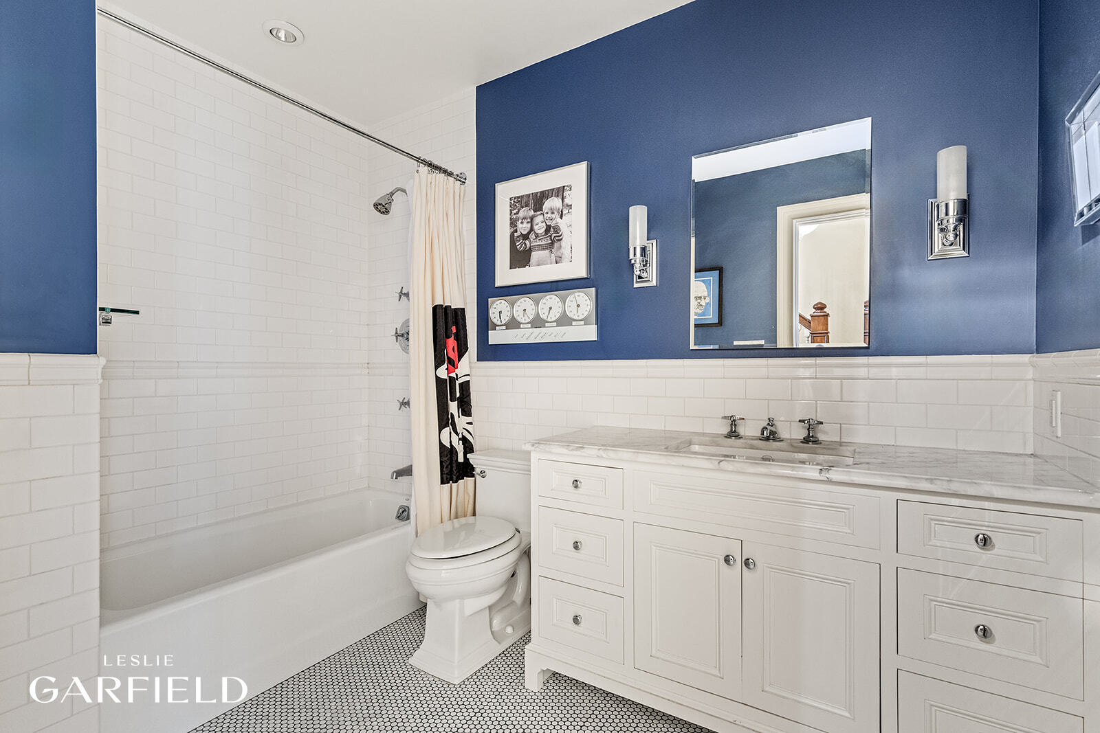 315 West 84th Street Manhattan, NY 10024 - Photo 11 of 20 a bathroom with a bathtub shower sink vanity and toilet