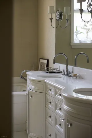 a bathroom with a sink and a mirror
