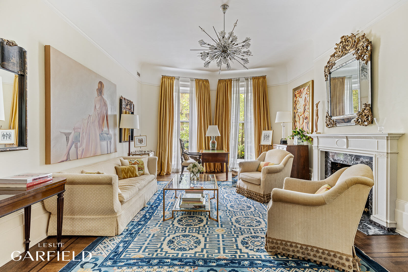 315 West 84th Street Manhattan, NY 10024 - Photo 4 of 20 a living room with fireplace furniture and a large window