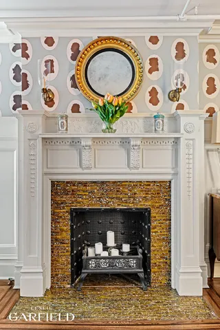 a fireplace with a clock on top of it