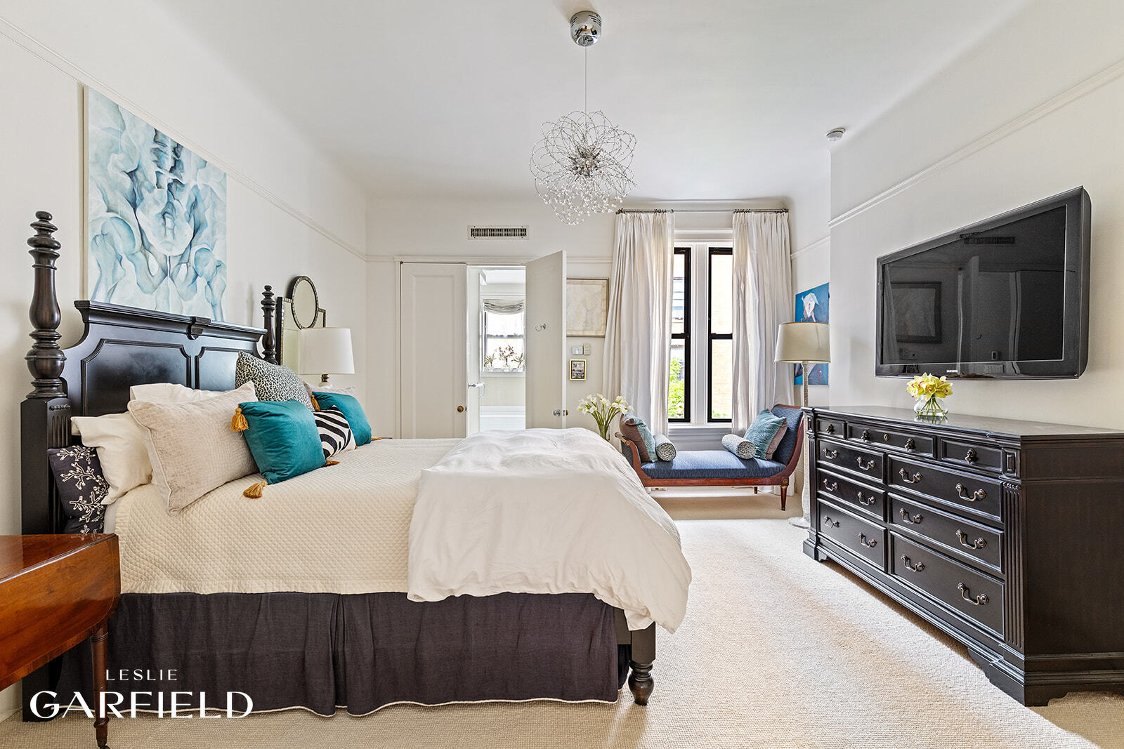 315 West 84th Street Manhattan, NY 10024 - Photo 9 of 20 a bedroom with a bed and a flat screen tv