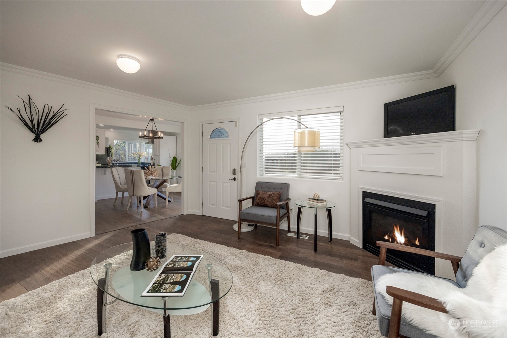 1508 Lake Avenue South Renton, WA 98055 - Photo 2 of 40 a living room with furniture a fireplace and a flat screen tv