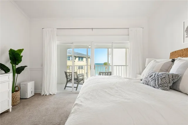 a spacious bathroom with a double vanity sink a mirror and a bathtub