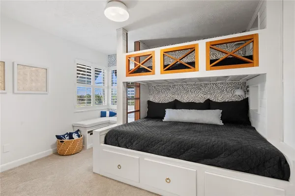 a bedroom with a bed and a couch