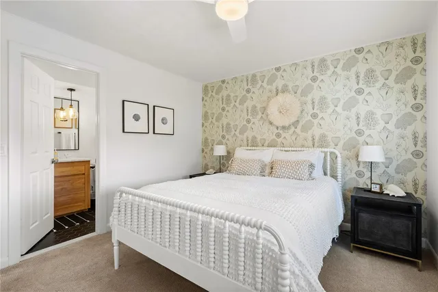 a view of a swimming pool with a yard and plants