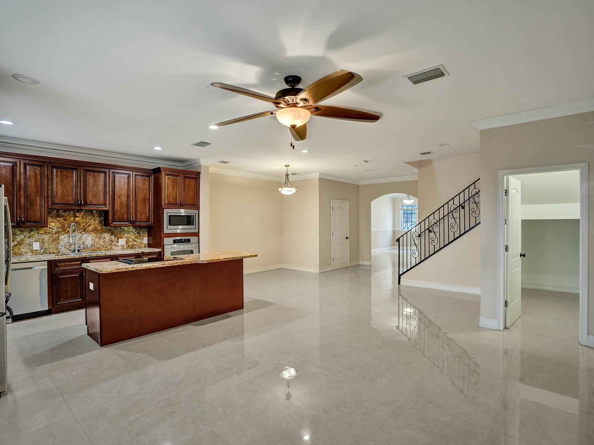 3243 Northeast 5th Street Pompano Beach, FL 33062 - Photo 9 of 43 Kitchen, family room and dining room