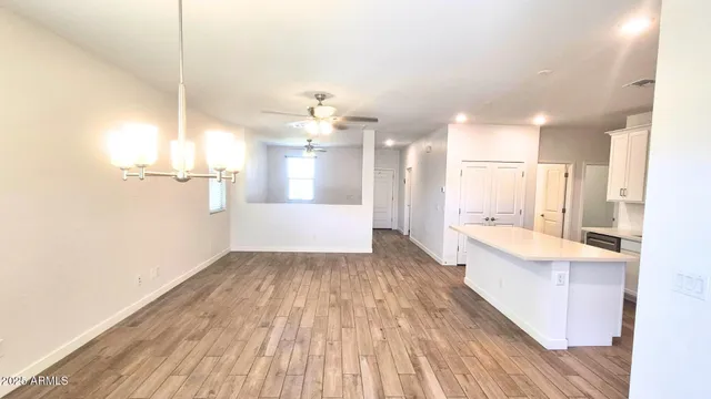 a view of a kitchen with wooden floor