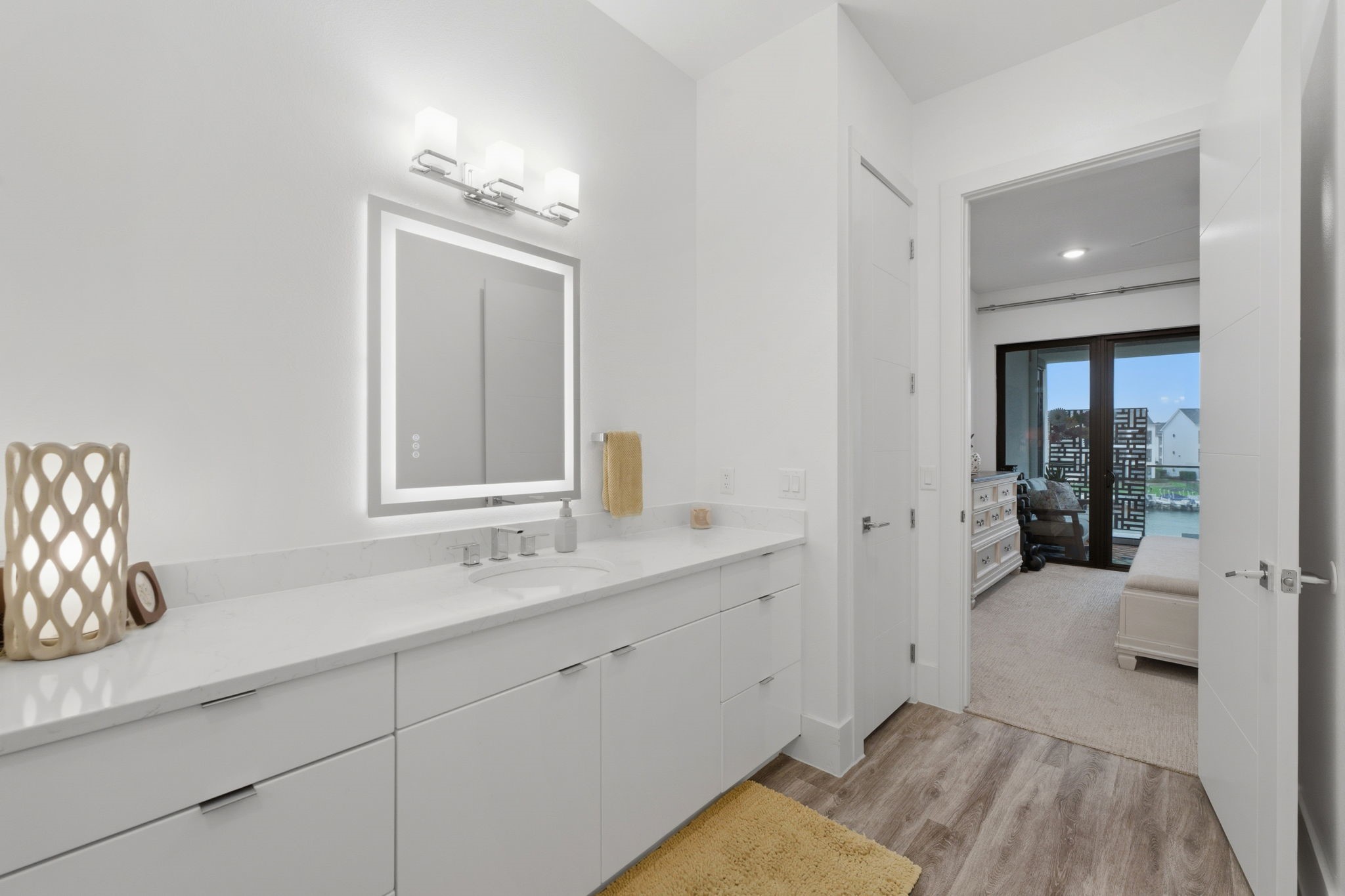 199 Waterpoint Court, Unit 202 Conroe, TX 77304 - Photo 21 of 41 a bathroom with a sink and a mirror