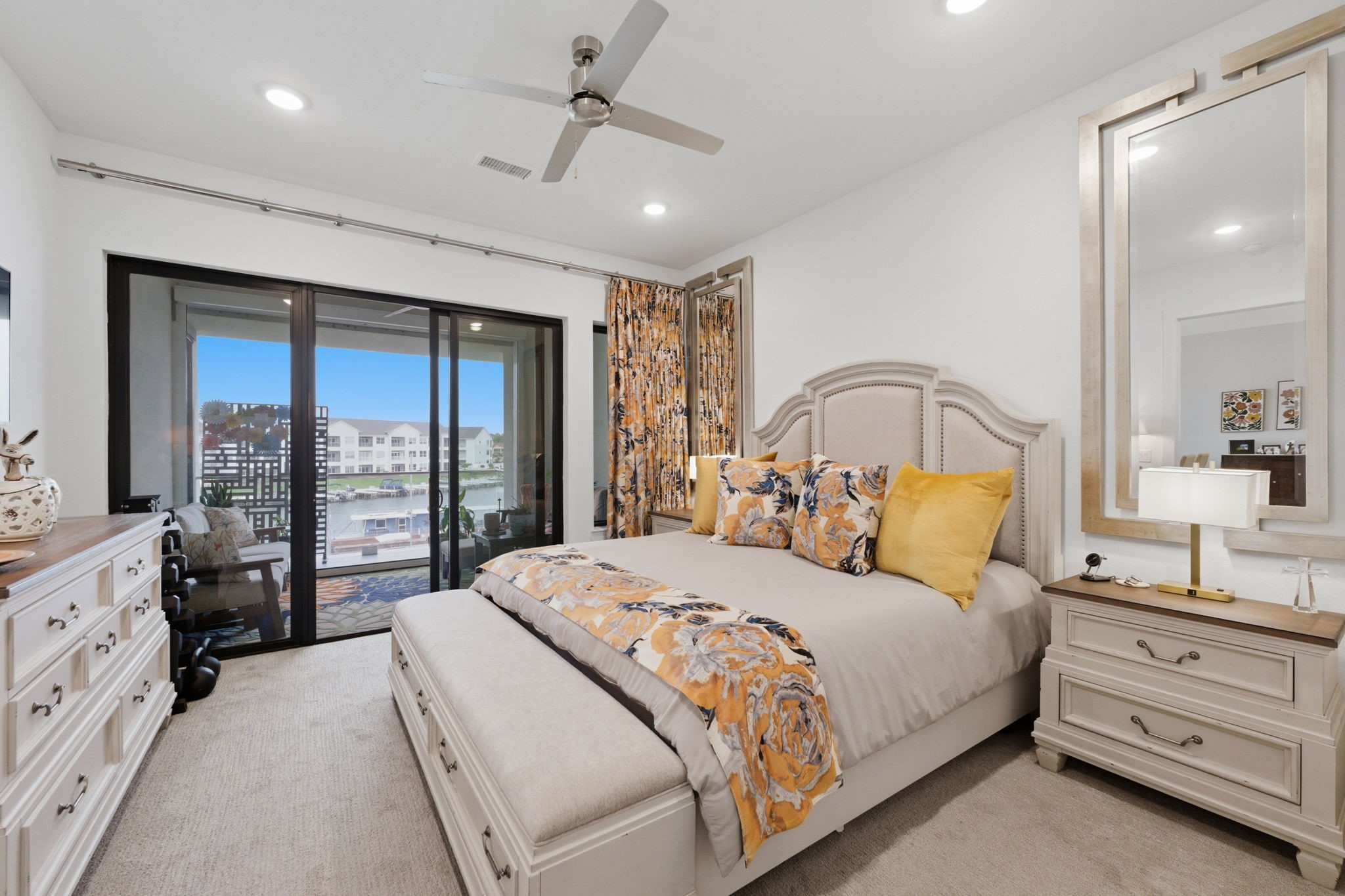 199 Waterpoint Court, Unit 202 Conroe, TX 77304 - Photo 23 of 41 a bedroom with a large bed and a window