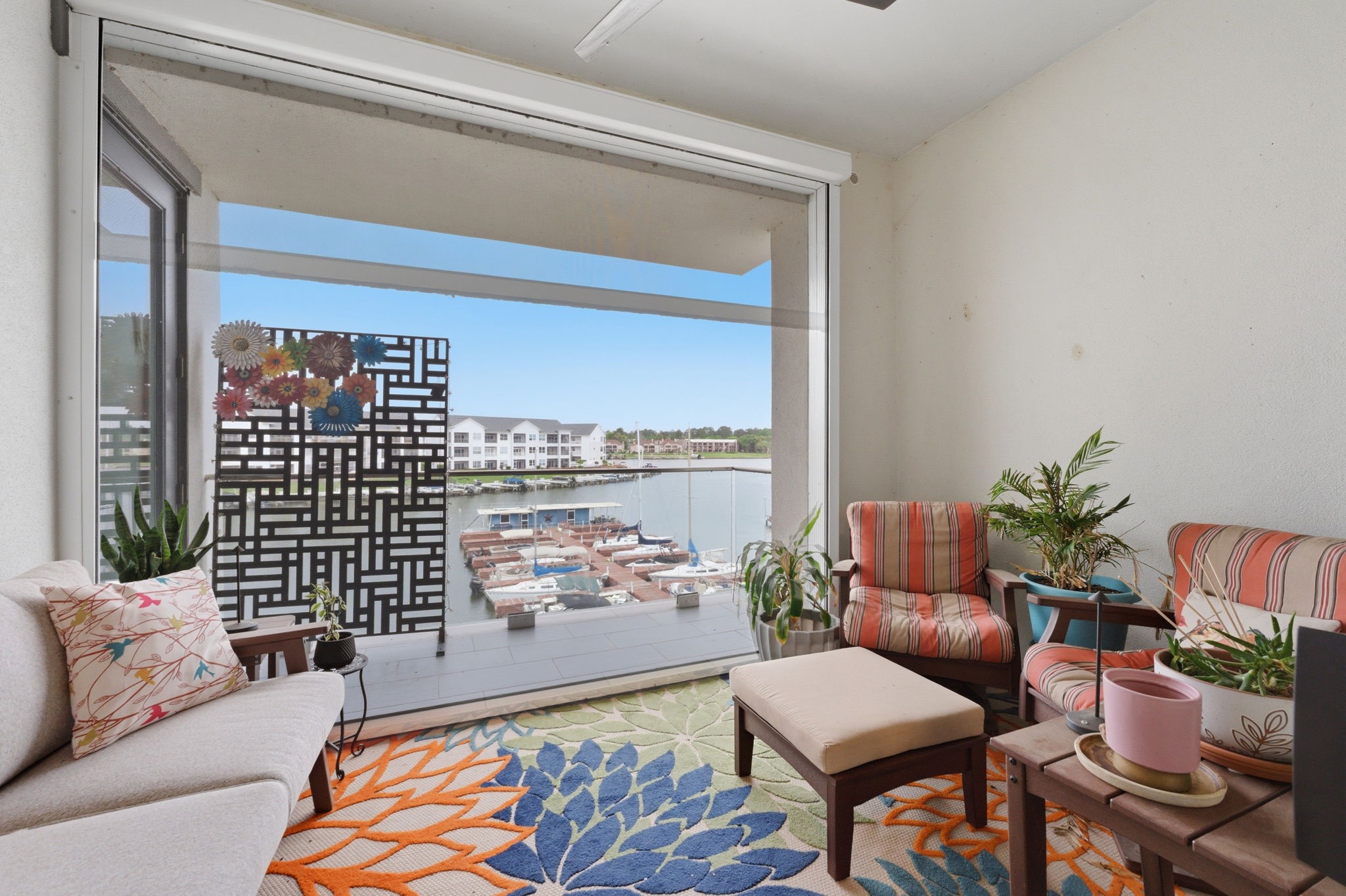 199 Waterpoint Court, Unit 202 Conroe, TX 77304 - Photo 26 of 41 a living room with furniture and a potted plant