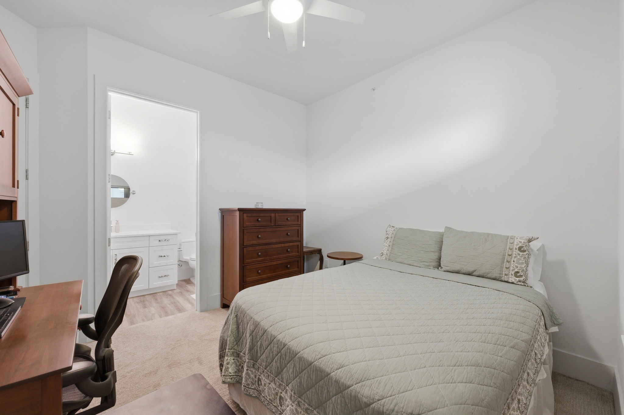 199 Waterpoint Court, Unit 202 Conroe, TX 77304 - Photo 27 of 41 a bedroom with a bed and a desk