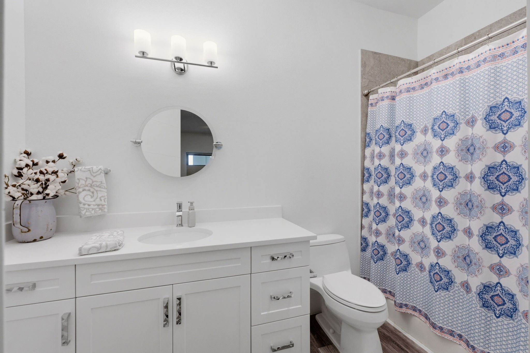 199 Waterpoint Court, Unit 202 Conroe, TX 77304 - Photo 29 of 41 a bathroom with a sink toilet and shower
