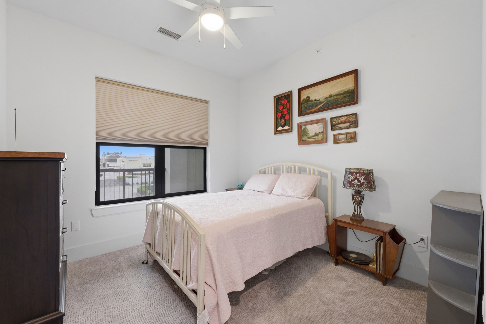 199 Waterpoint Court, Unit 202 Conroe, TX 77304 - Photo 30 of 41 a bedroom with a bed and a painting on the wall