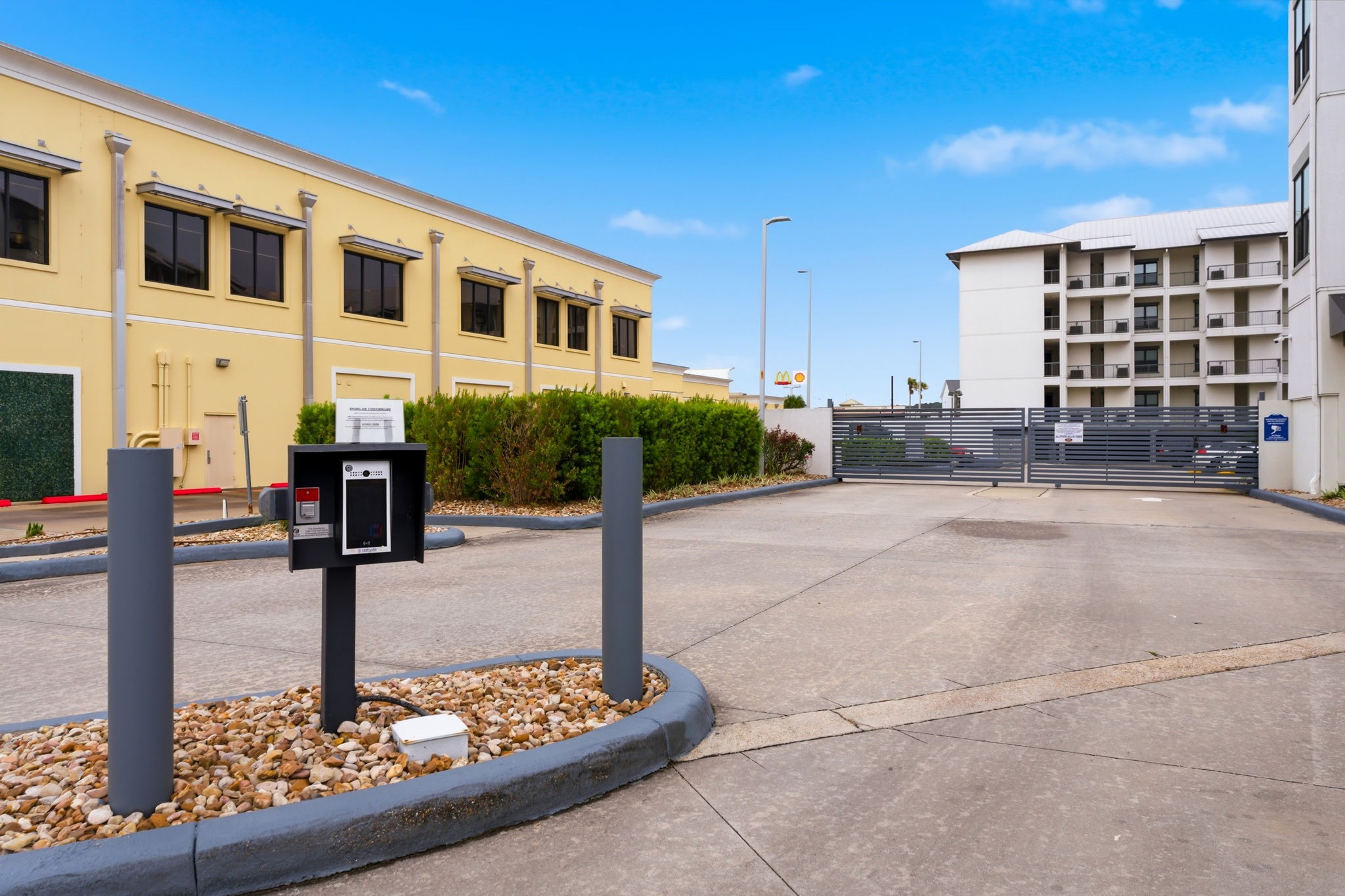 199 Waterpoint Court, Unit 202 Conroe, TX 77304 - Photo 33 of 41 a front view of a building with garden and plants