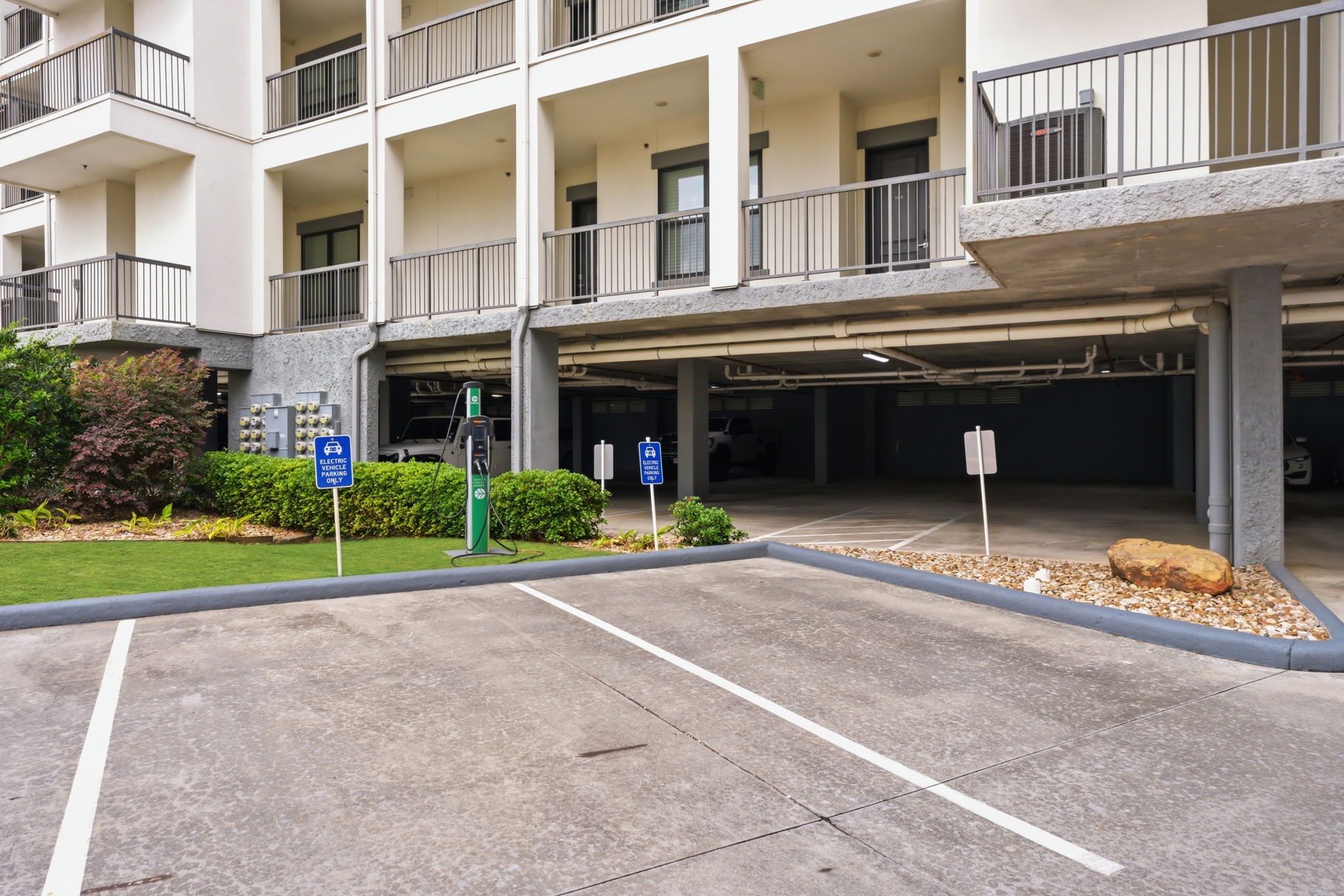 199 Waterpoint Court, Unit 202 Conroe, TX 77304 - Photo 35 of 41 a view of a building with a yard