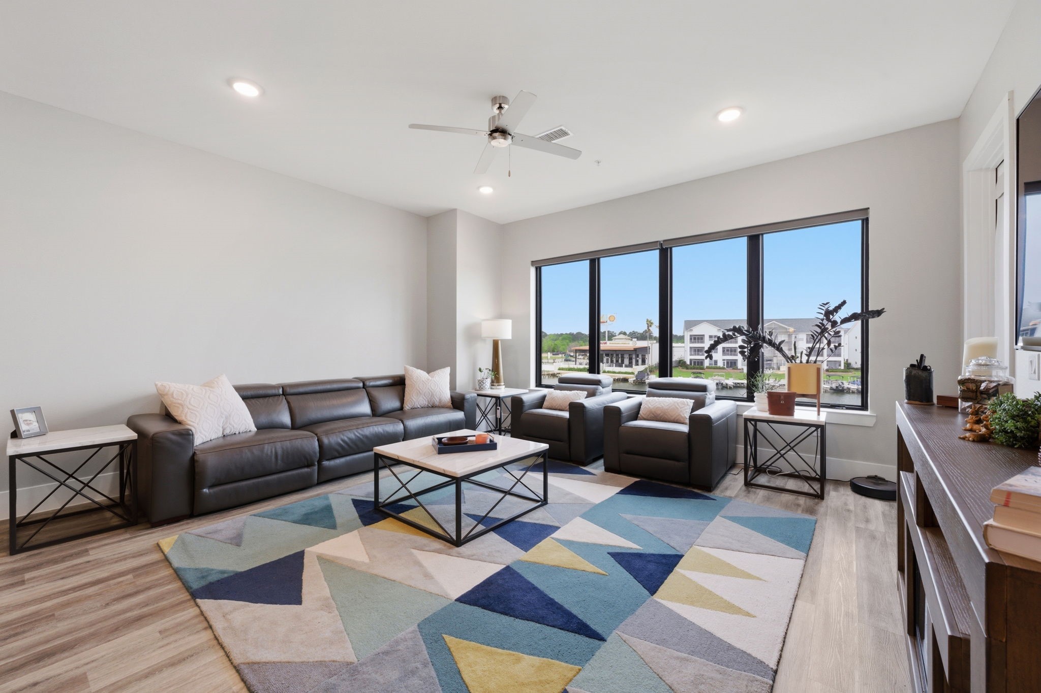 199 Waterpoint Court, Unit 202 Conroe, TX 77304 - Photo 7 of 41 a living room with furniture and a large window