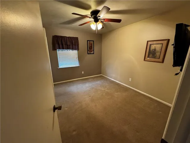a bathroom with a toilet sink and shower