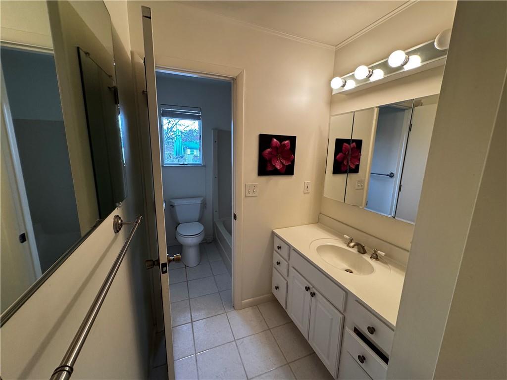 105 Patty Drive Uniontown, PA 15401 - Photo 19 of 25 a bathroom with a sink a toilet and a shower