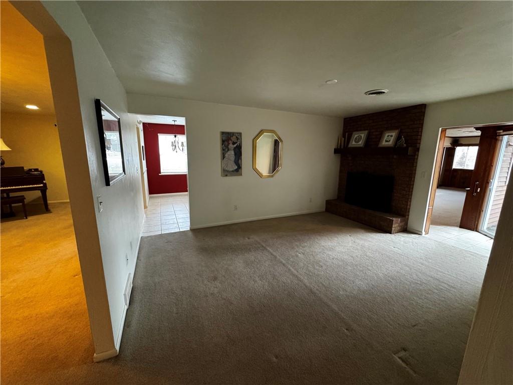105 Patty Drive Uniontown, PA 15401 - Photo 20 of 25 a view of livingroom with hardwood floor and front door