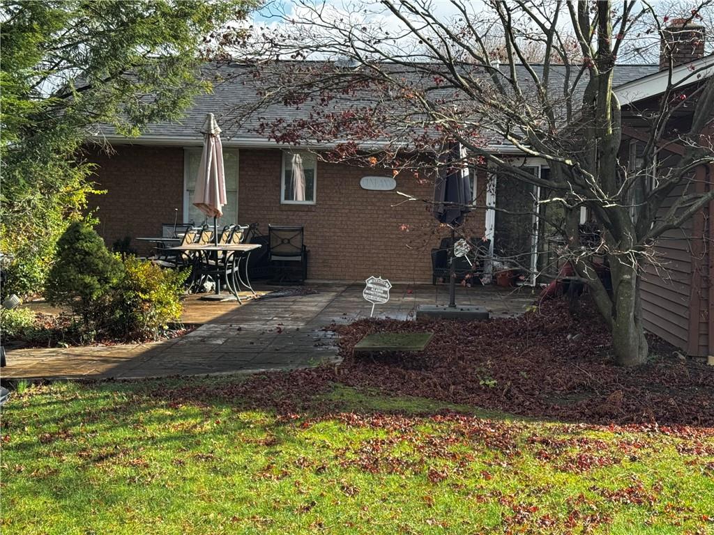 105 Patty Drive Uniontown, PA 15401 - Photo 2 of 25 a backyard of a house with table and chairs