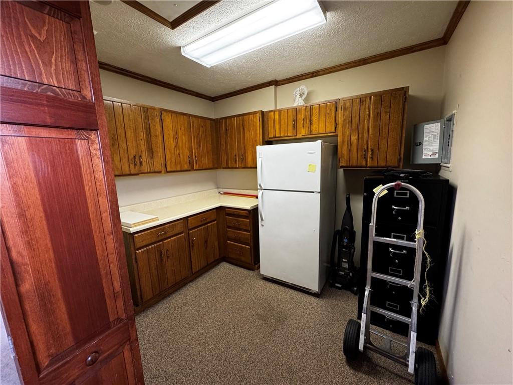 105 Patty Drive Uniontown, PA 15401 - Photo 23 of 25 a kitchen with refrigerator and cabinets