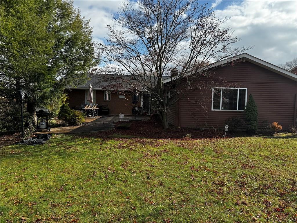 105 Patty Drive Uniontown, PA 15401 - Photo 6 of 25 a backyard of a house with table and chairs