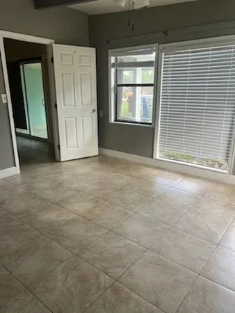 an empty room with windows