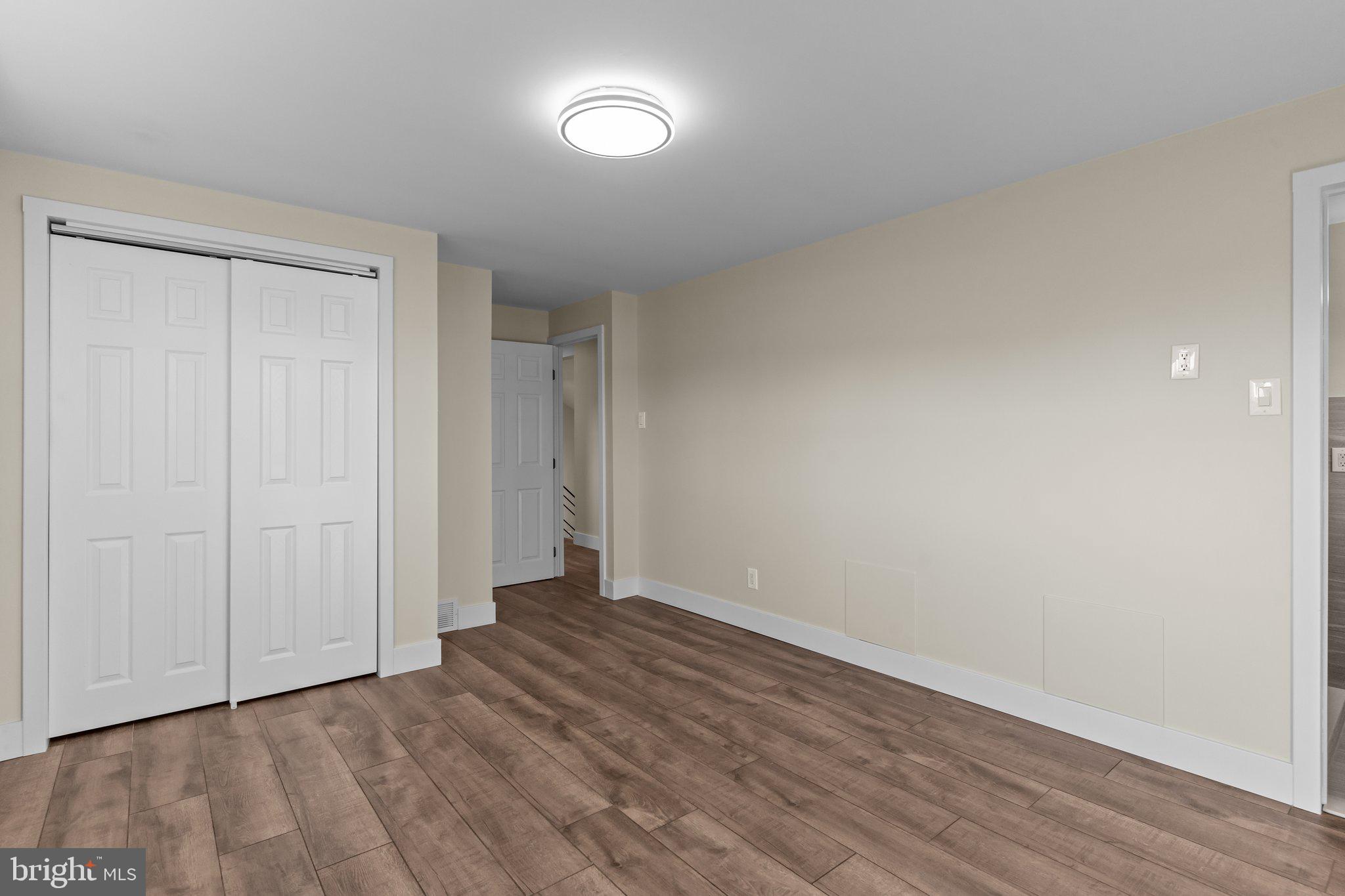 686 Spruce Road Warminster, PA 18974 - Photo 16 of 38 a view of an empty room with wooden floor