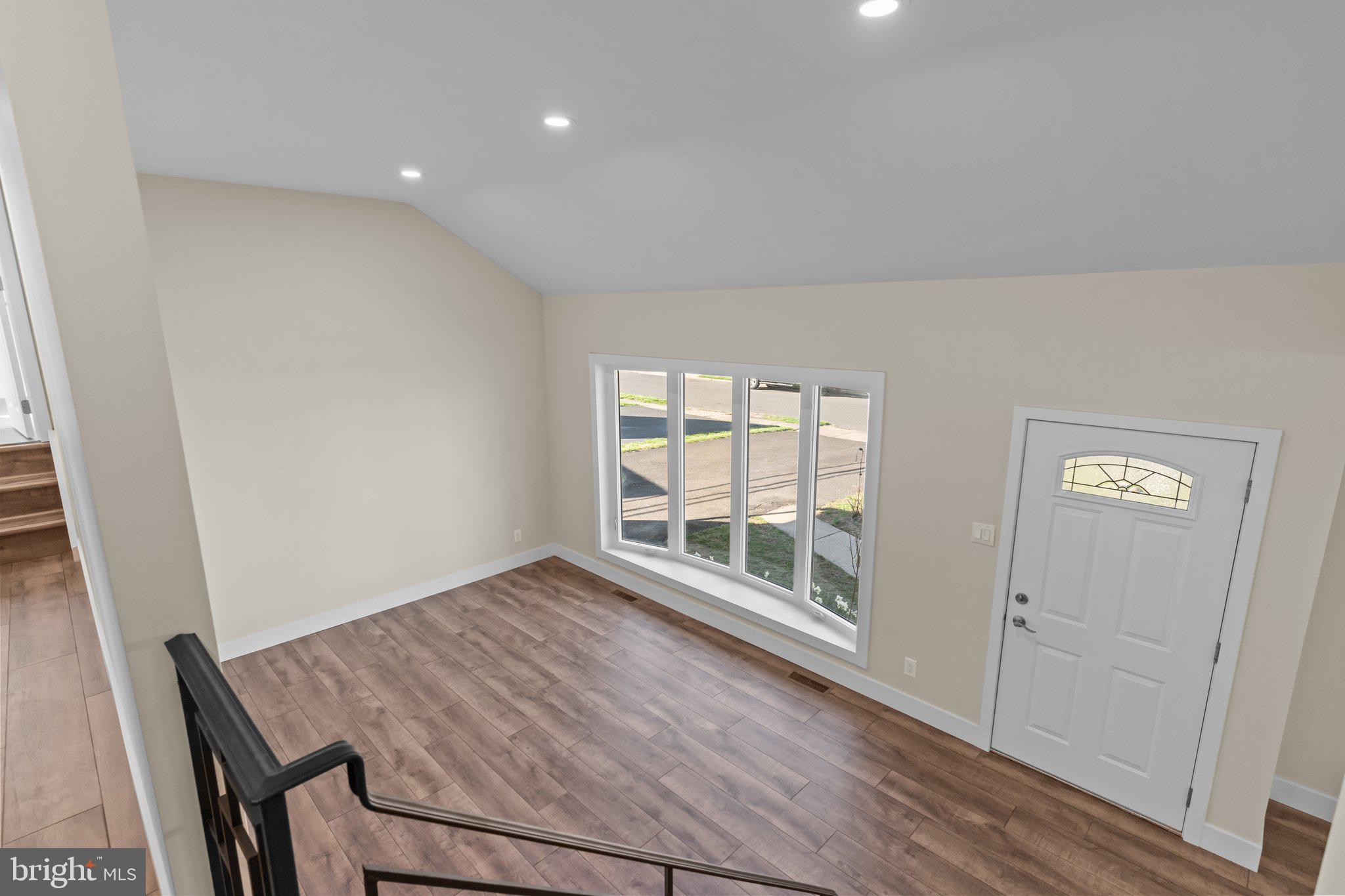 686 Spruce Road Warminster, PA 18974 - Photo 24 of 38 an empty room with wooden floor and windows