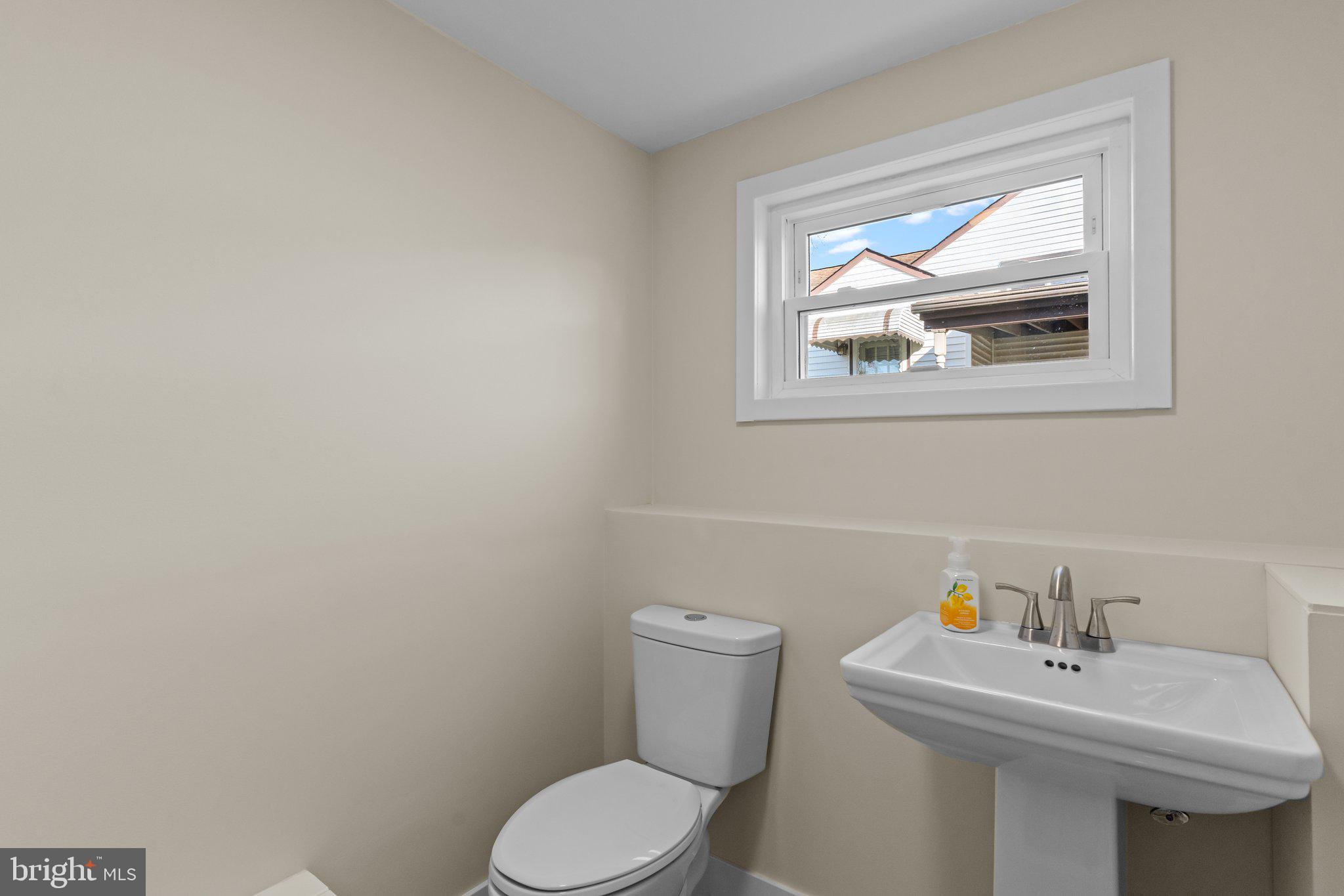 686 Spruce Road Warminster, PA 18974 - Photo 28 of 38 a bathroom with a sink mirror and toilet