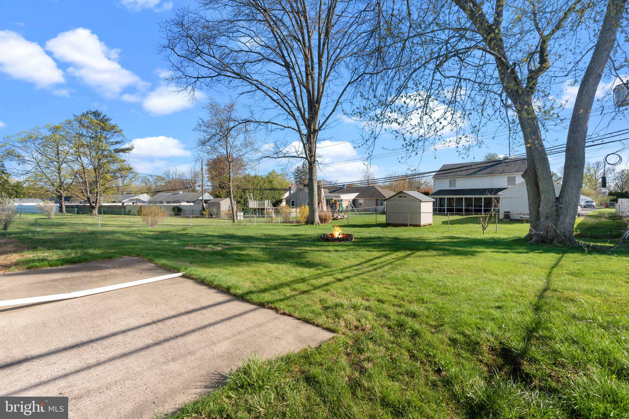686 Spruce Road Warminster, PA 18974 - Photo 29 of 38 a view of a house with a big yard and large trees