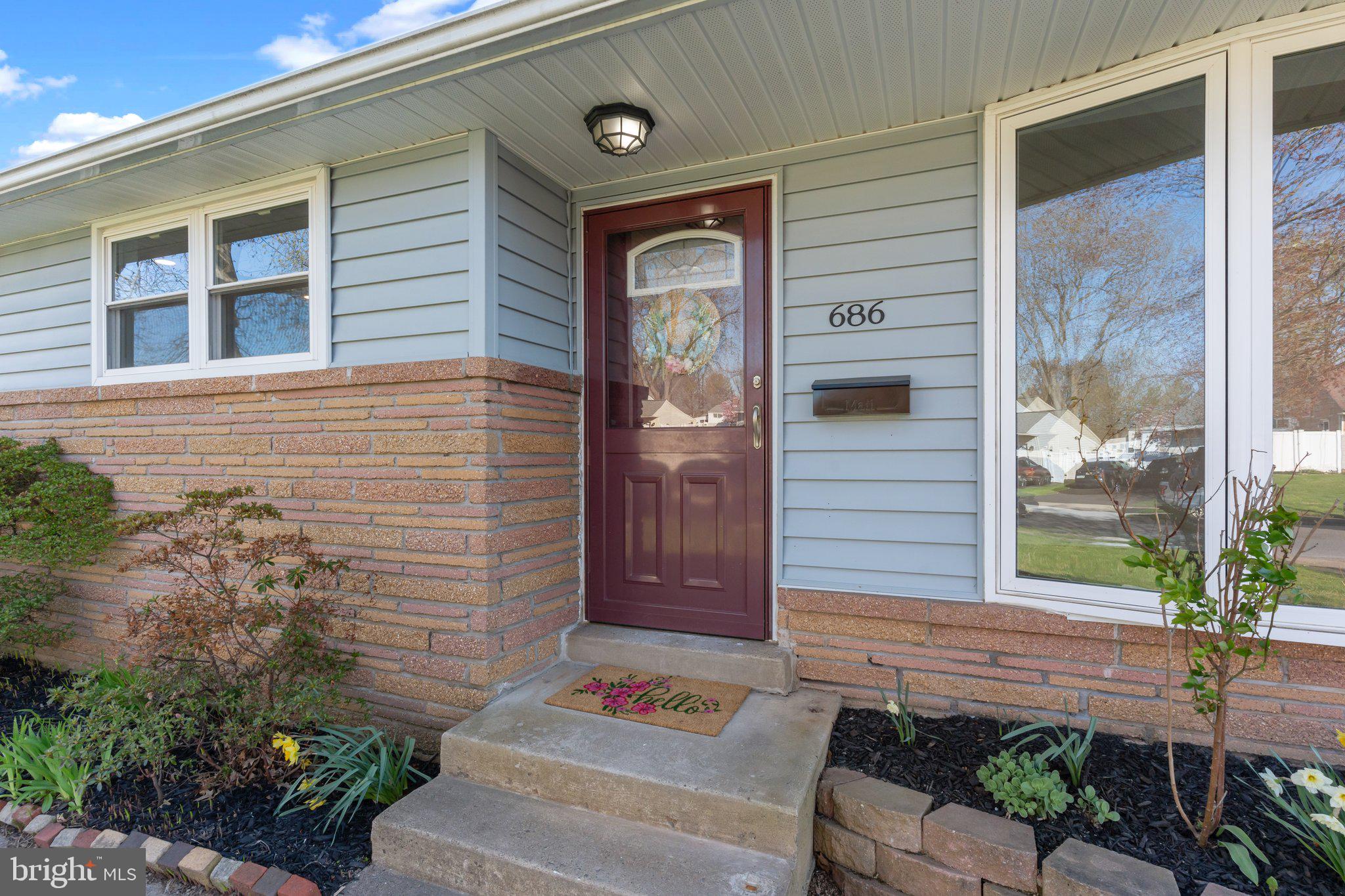 686 Spruce Road Warminster, PA 18974 - Photo 33 of 38 a front view of a house with a garden