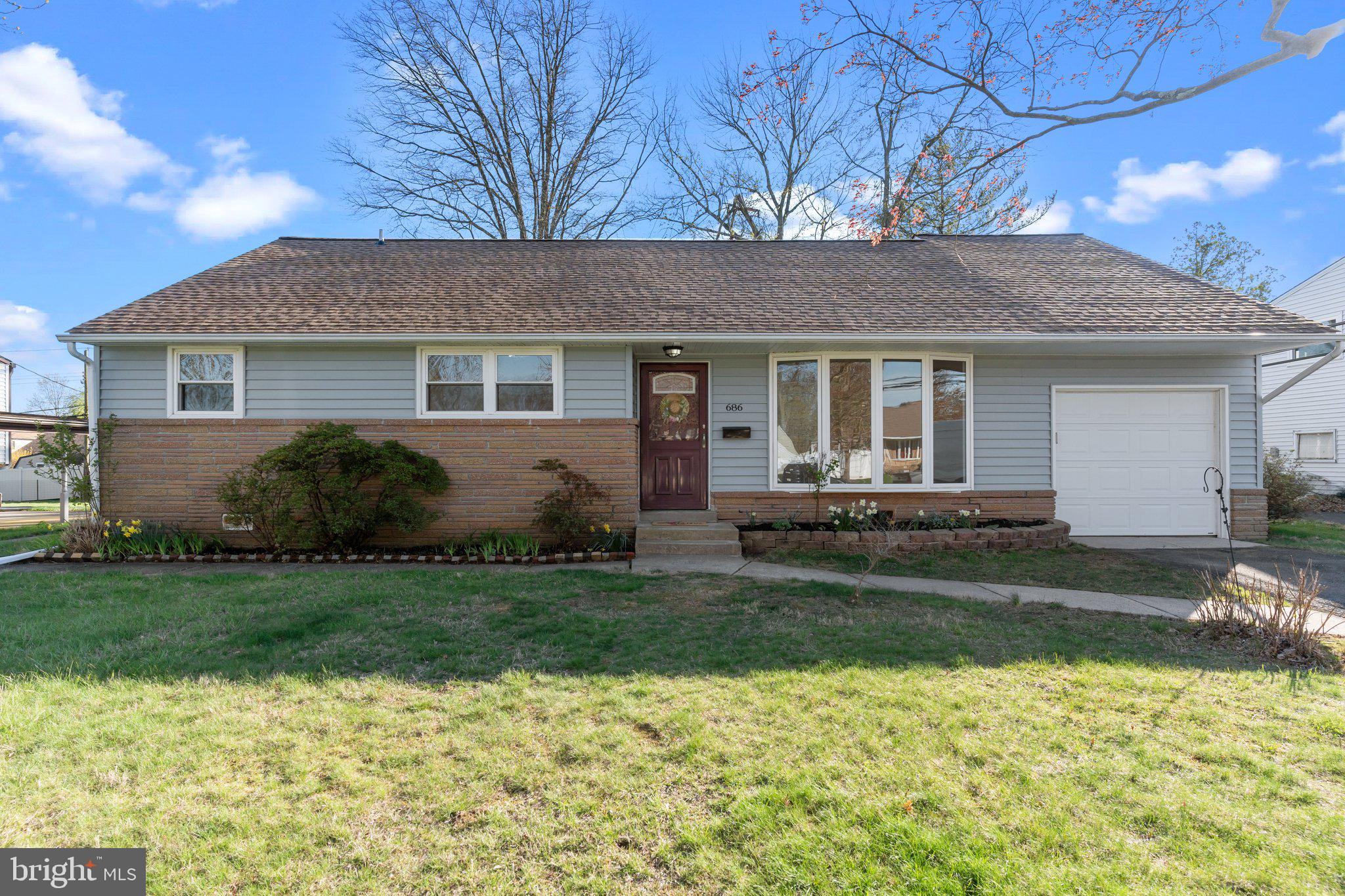 686 Spruce Road Warminster, PA 18974 - Photo 34 of 38 a front view of house with yard and green space