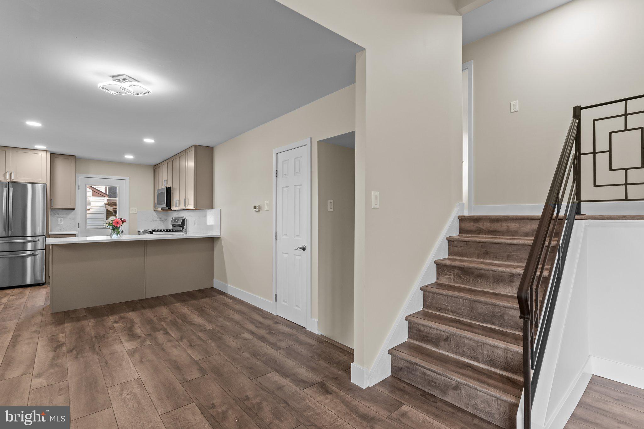 686 Spruce Road Warminster, PA 18974 - Photo 6 of 38 a view of kitchen with wooden floor and electronic appliances