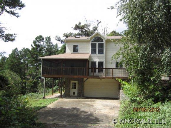 600 Oak Ridge Drive Clyde, NC 28721 - Photo 1 of 24 a view of a house with backyard and trees