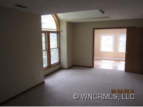 600 Oak Ridge Drive Clyde, NC 28721 - Photo 21 of 24 an empty room with windows and mirror