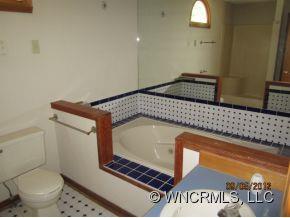 600 Oak Ridge Drive Clyde, NC 28721 - Photo 22 of 24 a bathroom with a toilet and a sink