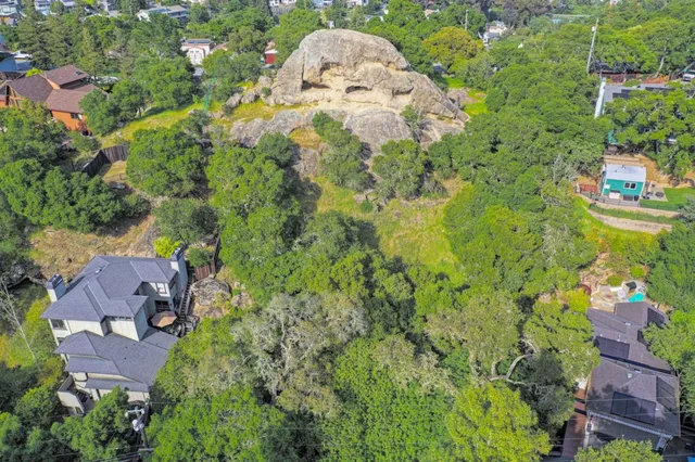 an aerial view of a house with yard