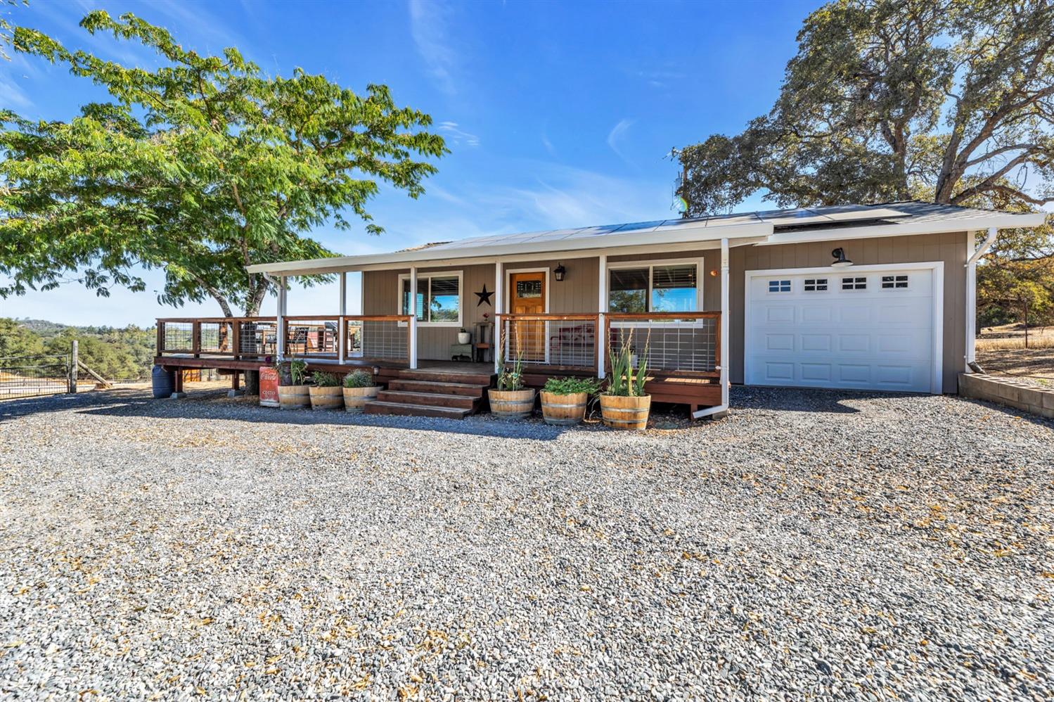 a view of a house with a yard and pathway